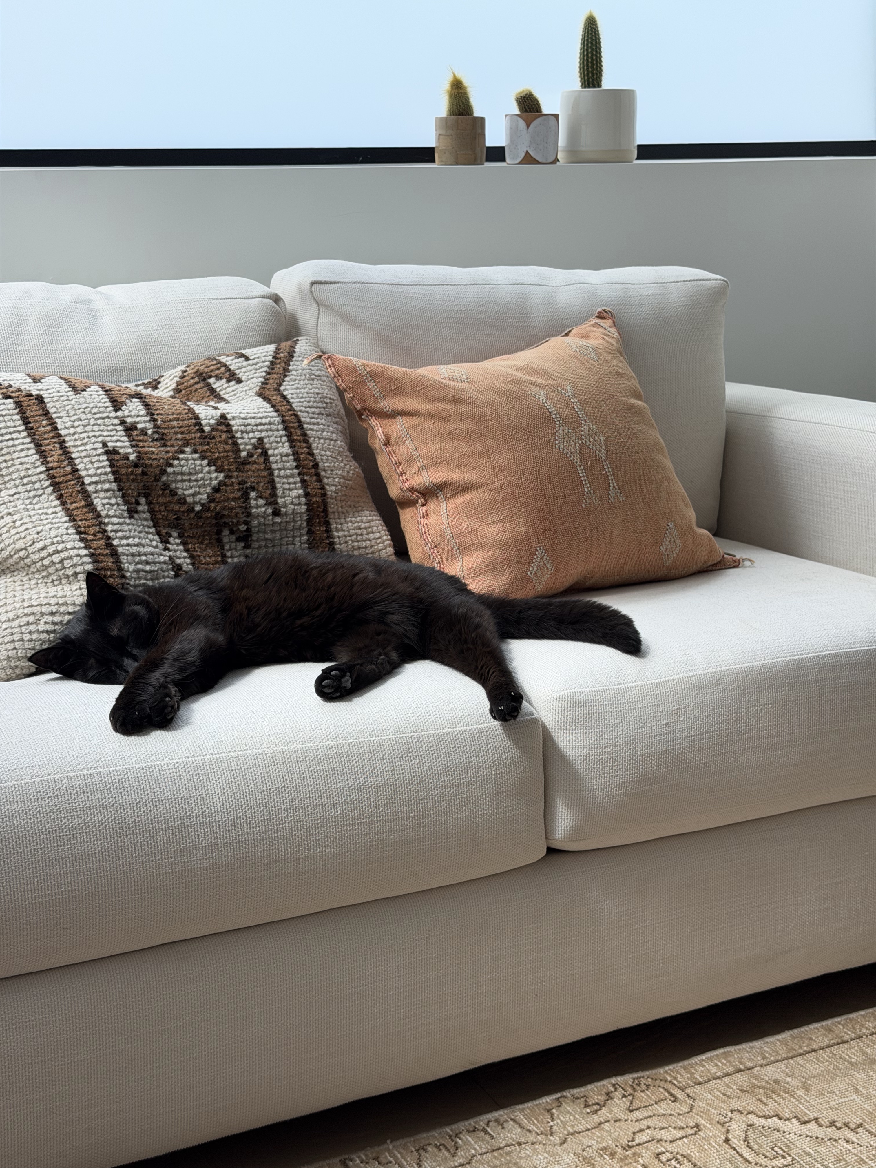 Re-upholstered cream sofa